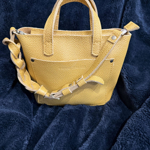 The Portland Leather Bonnie in Sunshine Yellow is pure happiness in bag form! 💛☀️ The color is - customer review photo