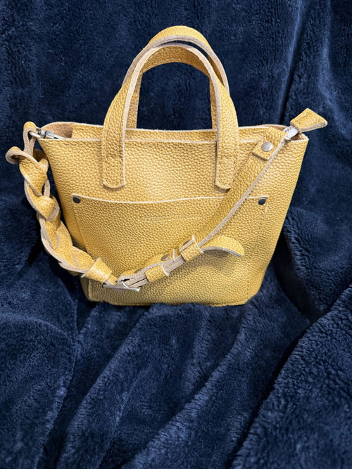 The Portland Leather Bonnie in Sunshine Yellow is pure happiness in bag form! 💛☀️ The color is - customer review photo