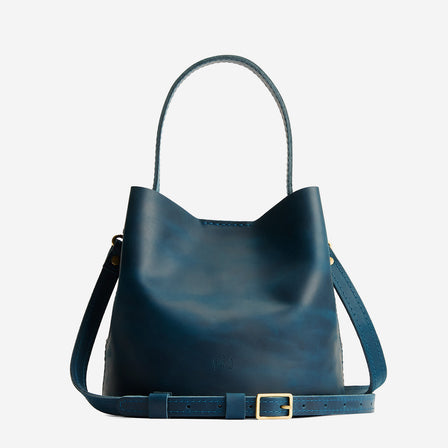 Westward Blue*Small | Symmetrical bucket bag with handle, latch closure, and removable crossbody strap
