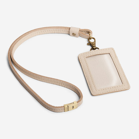 Pebbled Bone | A leather lanyard attached to a matching card holder on a white background