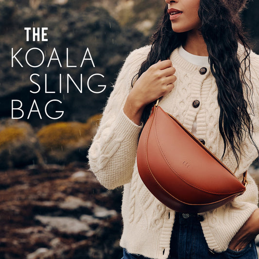 A model wearing a Koala Sling Bag in the rain