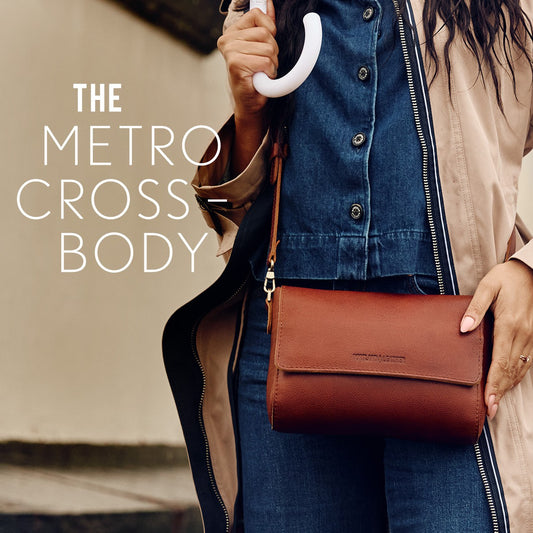 A model wearing a Metro Crossbody in Nutmeg