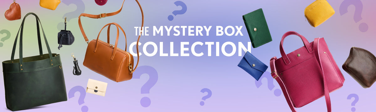 Promotional graphic for 'The Mystery Box Collection' featuring bags and leather small goods  set against a pastel gradient background with purple question marks.