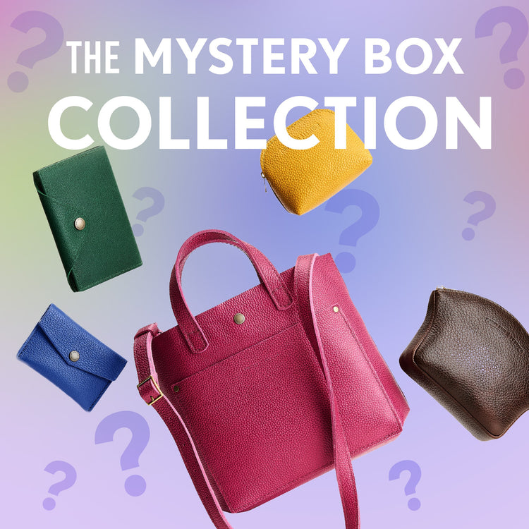 Promotional graphic for 'The Mystery Box Collection' featuring bags and leather small goods  set against a pastel gradient background with purple question marks.