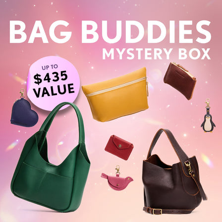 A collection of bags and small goods. Text reads "Bag Buddies Mystery Box. Up to $435 value"