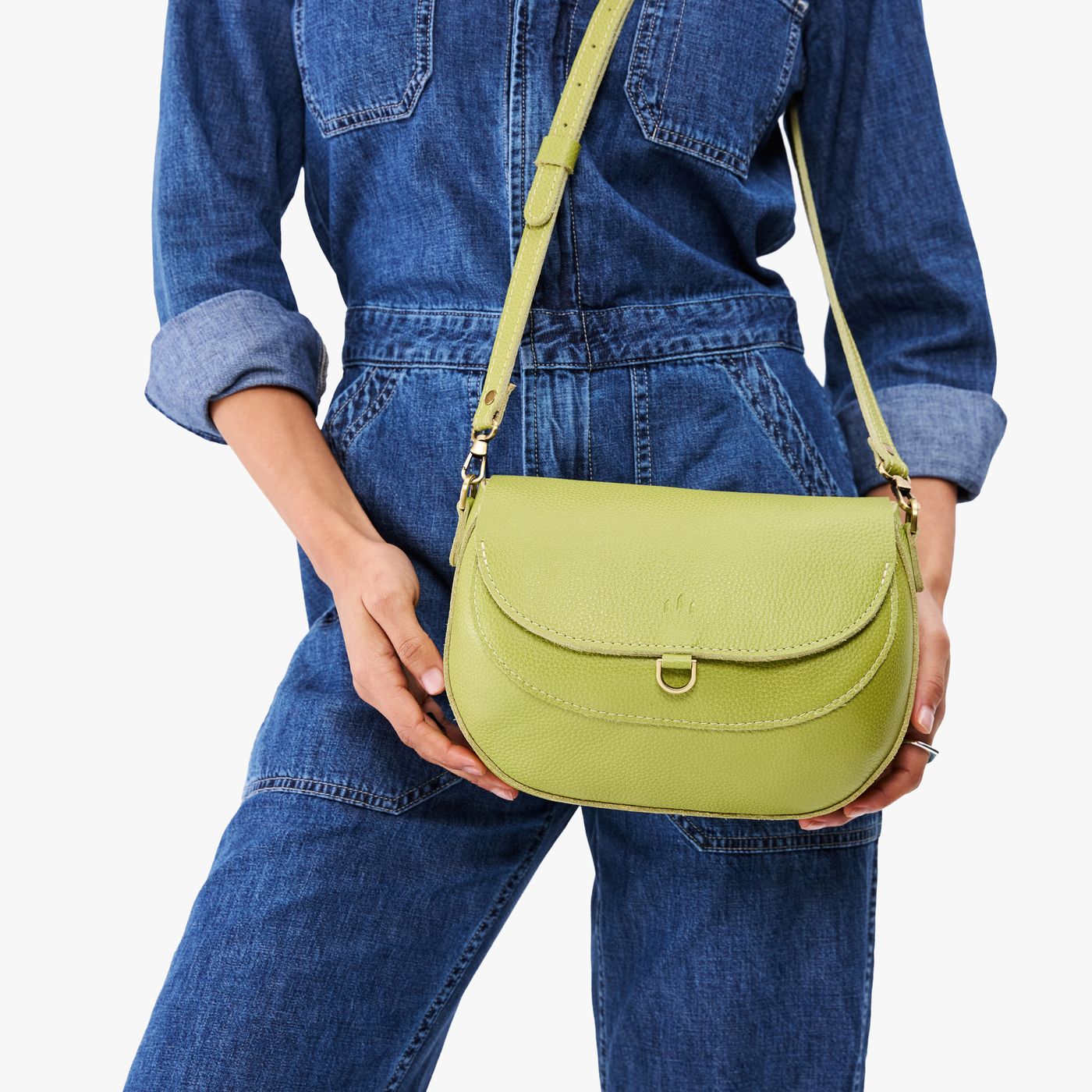 All Variants | Model holding large Monaco Crossbody in Wasabi
