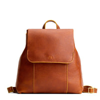 Sienna | Leather backpack with magnetic flap closure on a white background