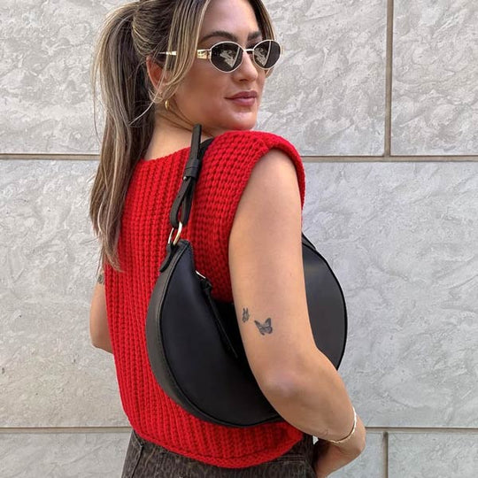 Person outside holding Nora Shoulder Bag