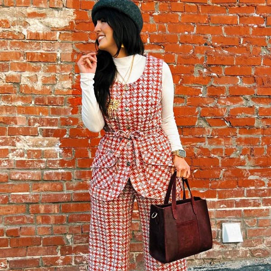 Person outside holding Lola Crossbody Tote