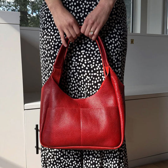 Person holding Chili Red Madison Shoulder Bag