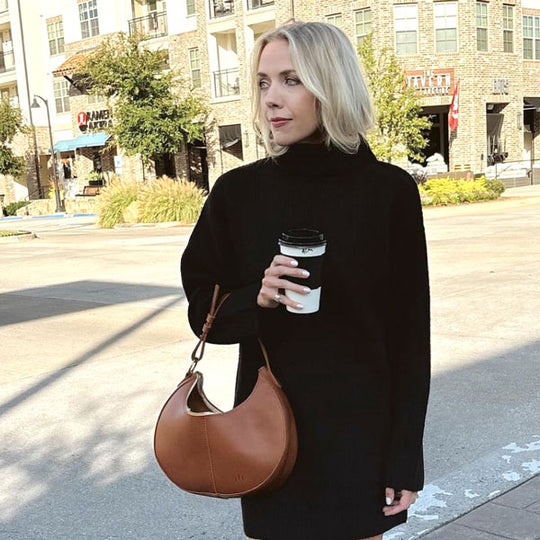 Person outside holding Nora Shoulder Bag