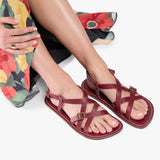 Marsala | Person wearing strappy leather sandals with two buckle accents