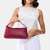 Orchid | Model holding a dark brown colored bowler style hand bag