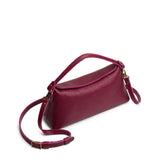 Orchid | Leather bowler bag with magnetic closure against a white background