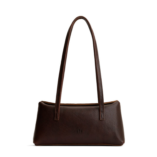 Coldbrew | Leather bowler bag with magnetic closure against a white background