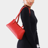 Ruby | Person holding leather bowler bag with magnetic closure