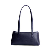 Cobalt | Leather bowler bag with magnetic closure against a white background