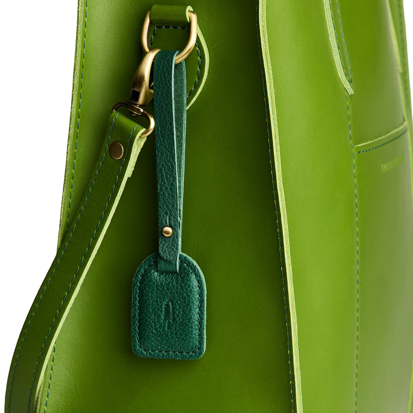 Bacalar | Simple oval tab tassel with Sam Browne closure on a bag