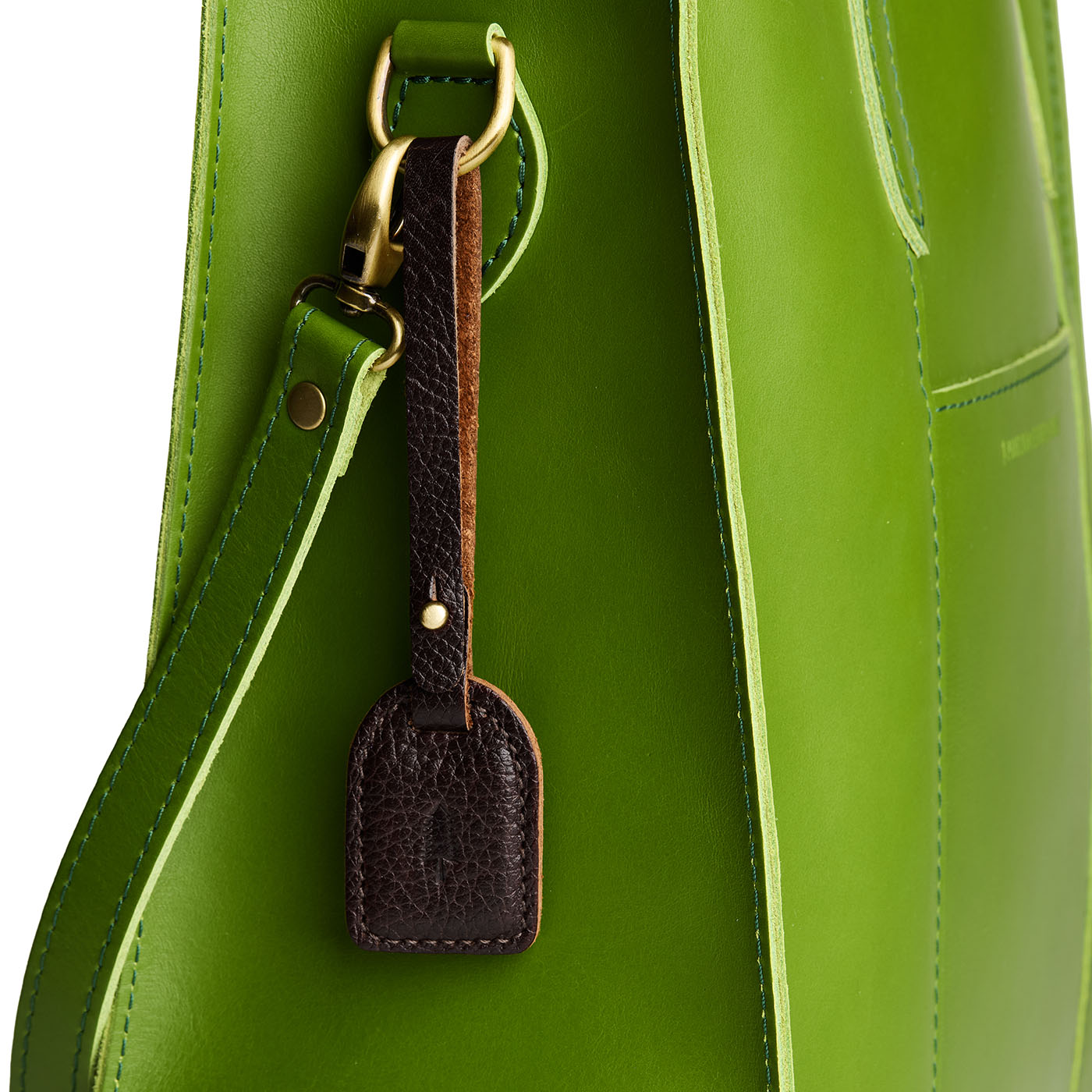 Coldbrew | Simple oval tab tassel with Sam Browne closure on a bag