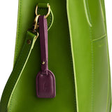 Lollipop | Simple oval tab tassel with Sam Browne closure on a bag