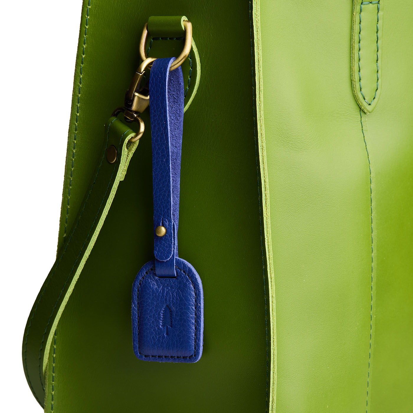 Molino Blue | Simple oval tab tassel with Sam Browne closure on a bag
