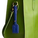 Molino Blue | Simple oval tab tassel with Sam Browne closure on a bag