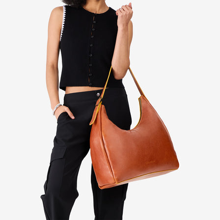 Orchid*Oversized | U-shaped, flat-bottomed leather shoulder bag with adjustable strap