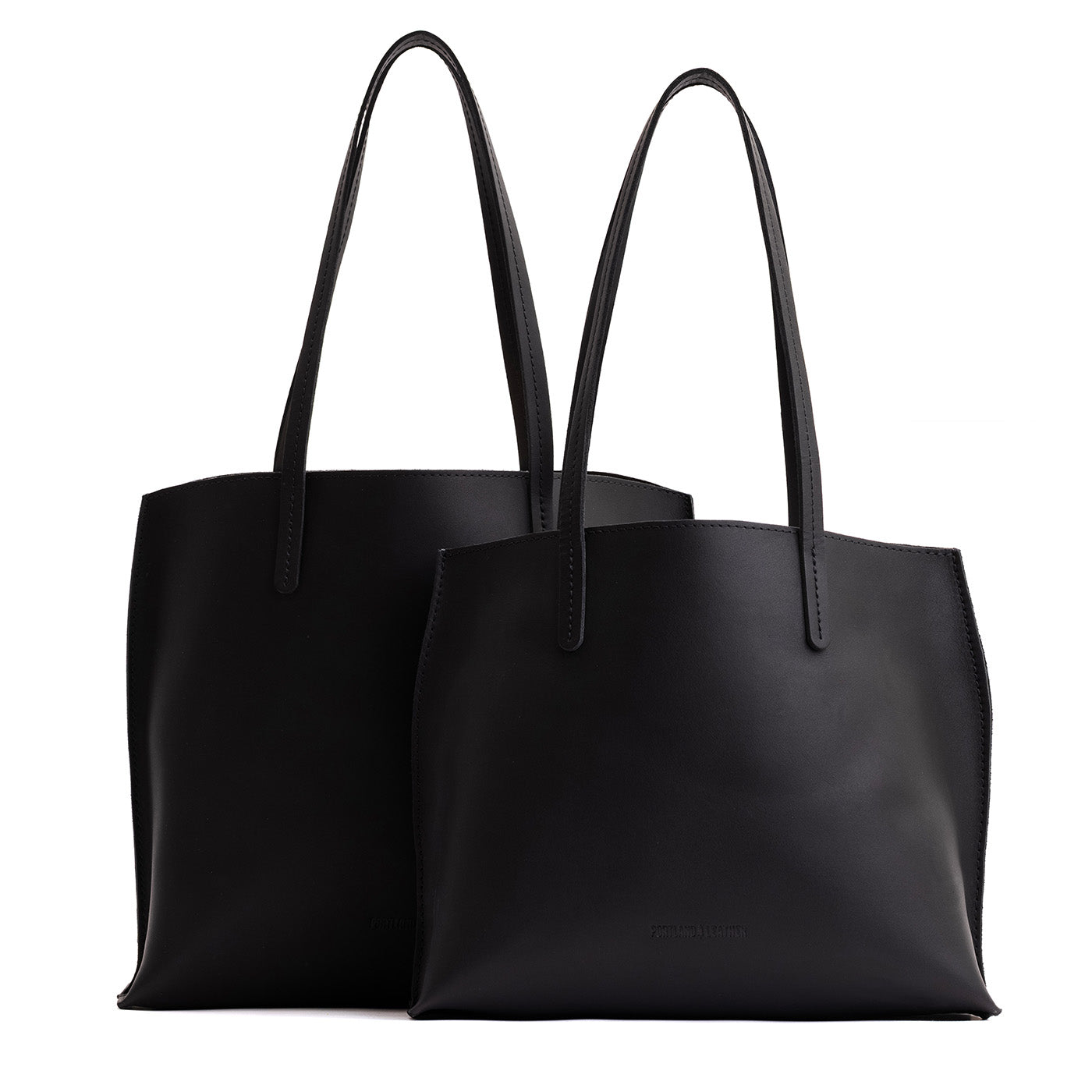 Black | Side by side comparison of both sizes of leather totes
