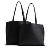 Black | Side by side comparison of both sizes of leather totes