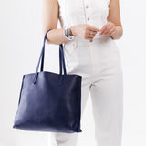 Cobalt Large | Model holding leather tote bag with interior snap key loop