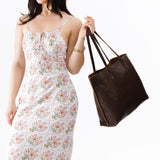 Coldbrew Large | Model holding leather tote bag with interior snap key loop