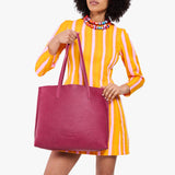 Cosmo Large | Model holding leather tote bag with matching leather handles