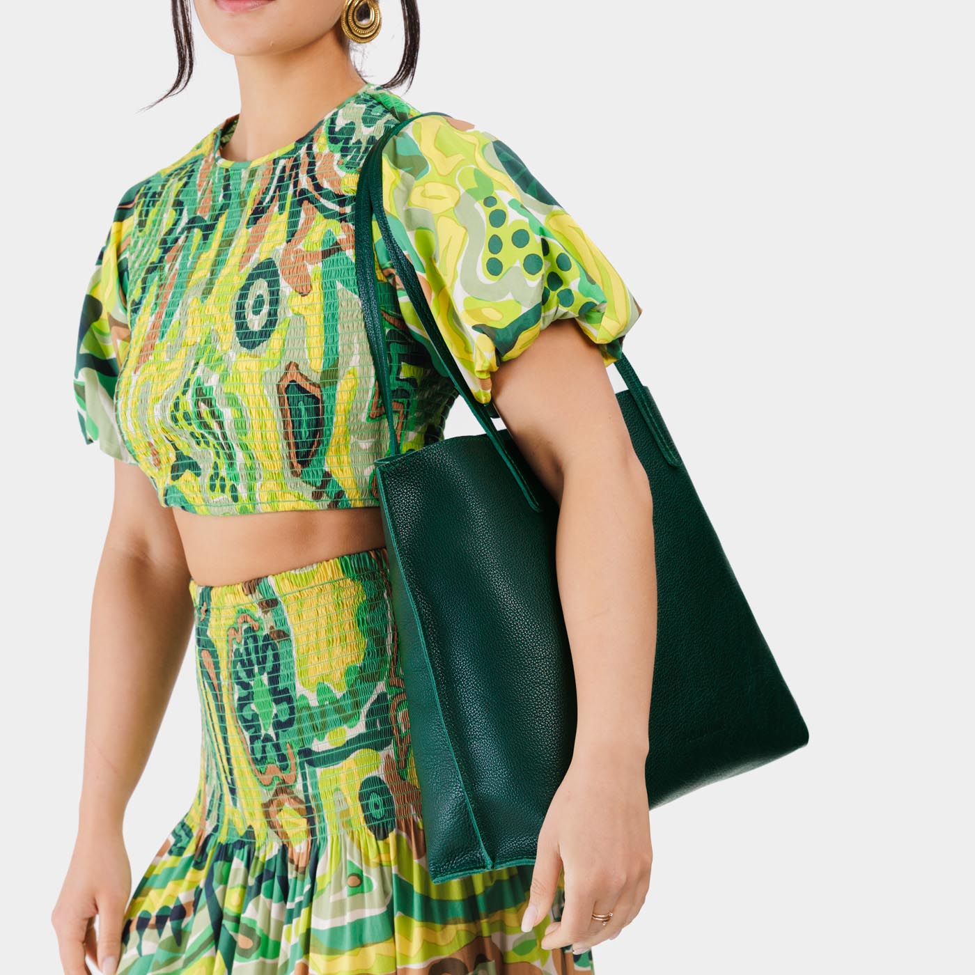Forest Green*Large | Model holding leather tote bag with interior snap key loop