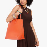 Koi Large | Model carrying leather tote bag with matching leather handles