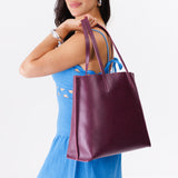 Lollipop Large | Model holding leather tote bag with interior snap key loop