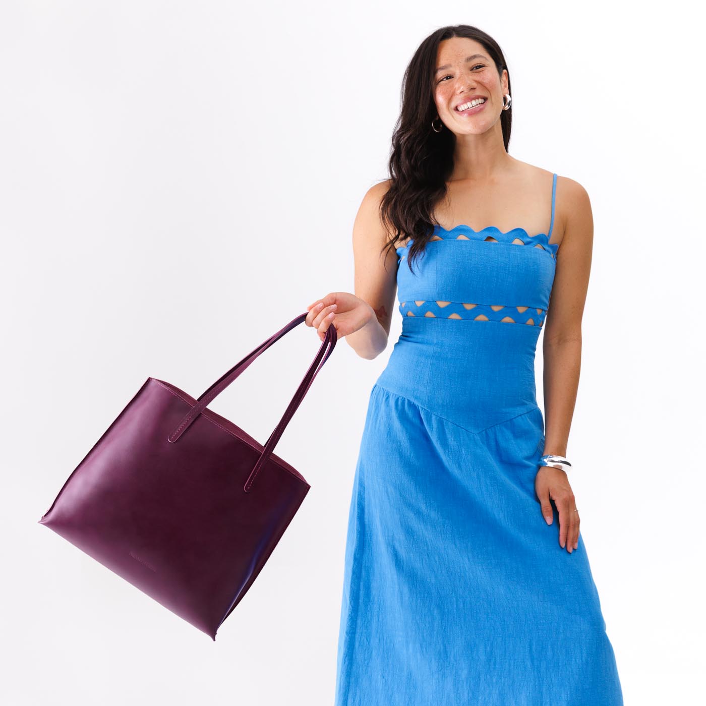 Lollipop*Large | Model holding leather tote bag with interior snap key loop