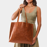 Meadow Large | Model holding leather tote bag with interior snap key loop