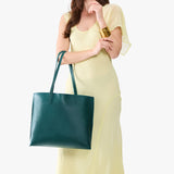 Sea Glass Large | Model carrying leather tote bag with matching leather handles