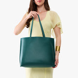 Sea Glass Large | Model holding leather tote bag with matching leather handles