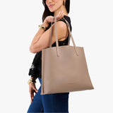 Stone Large | Model carrying leather tote bag with matching leather handles