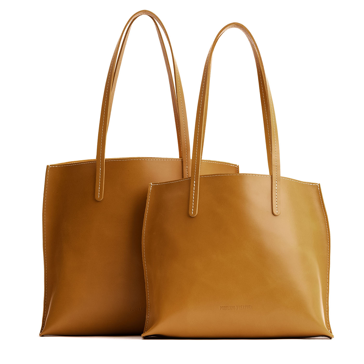 Mango | Side by side comparison of both sizes of leather totes