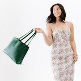 Bacalar Medium | Model holding leather tote bag with interior snap key loop