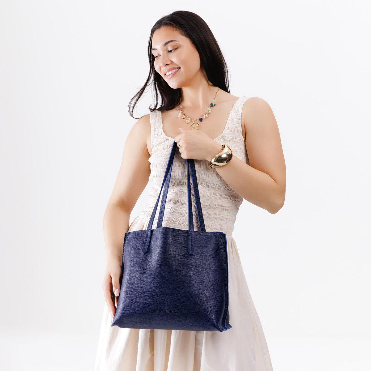 Cobalt*Medium | Model holding leather tote bag with interior snap key loop