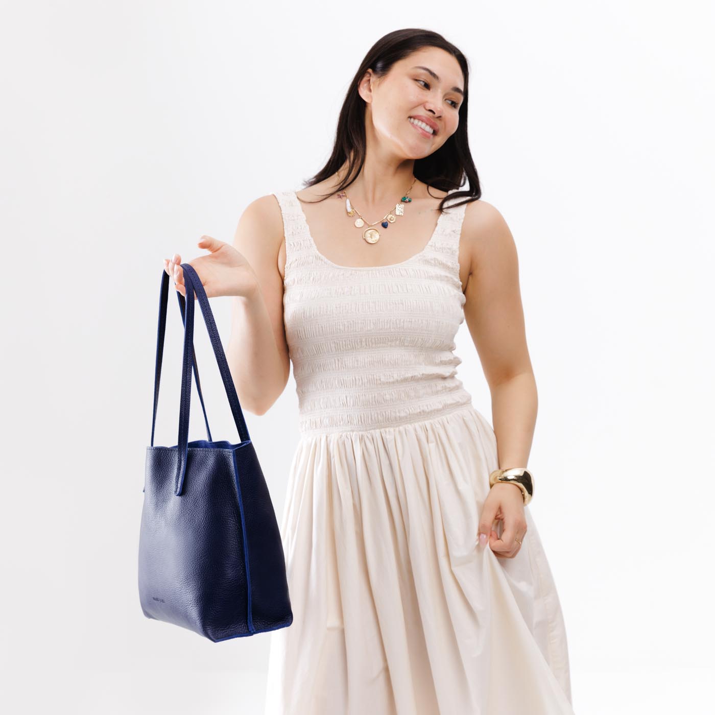 Cobalt*Medium | Model holding leather tote bag with interior snap key loop