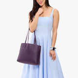 Empire Medium | Model carrying leather tote bag with matching leather handles