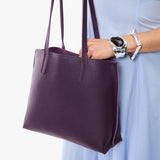 Empire Medium | Model holding leather tote bag with matching leather handles