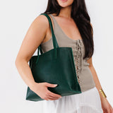 Forest Green Medium | Model holding leather tote bag with interior snap key loop