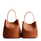 Honey | Size comparison image of two symmetrical leather bucket bags
