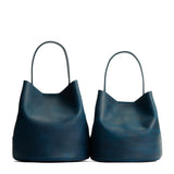 Westward Blue | Size comparison image of two symmetrical leather bucket bags