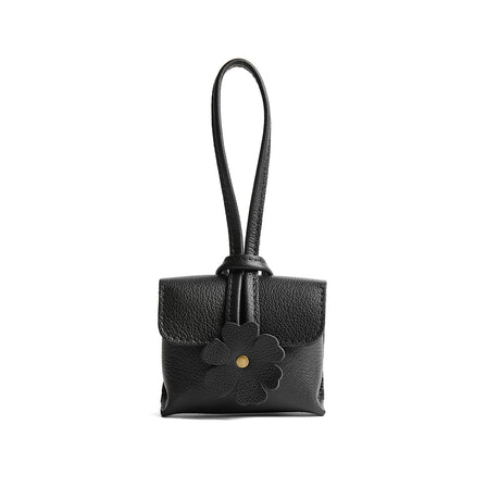 Pebbled--black | Wristlet pouch with loop strap and a flower design